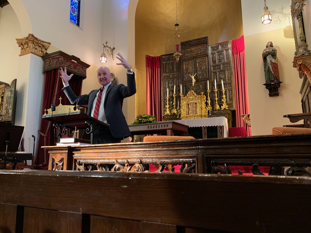 Eric speaking at a church