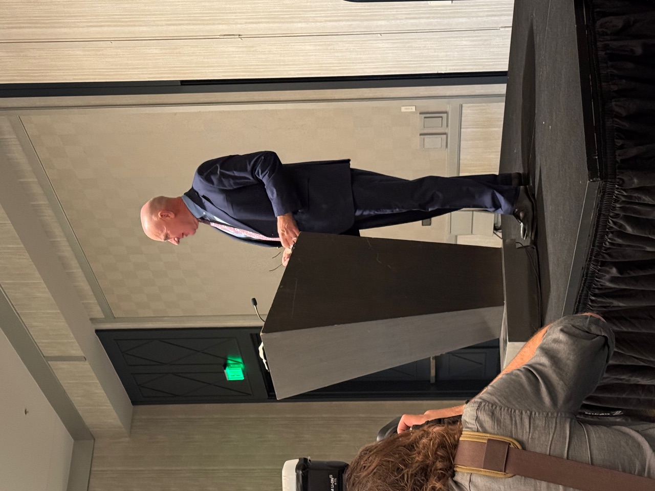 Eric speaking on stage