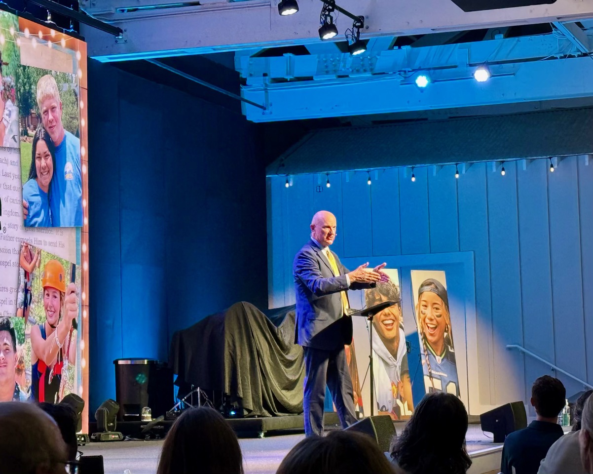 Eric Scofield speaking on stage